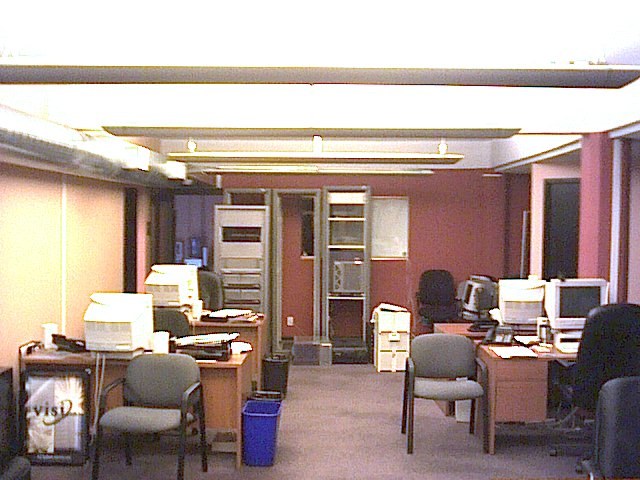 The Next Level and Wiremix office on downtown Howe Street around 2000, with desks, computers, and server racks.