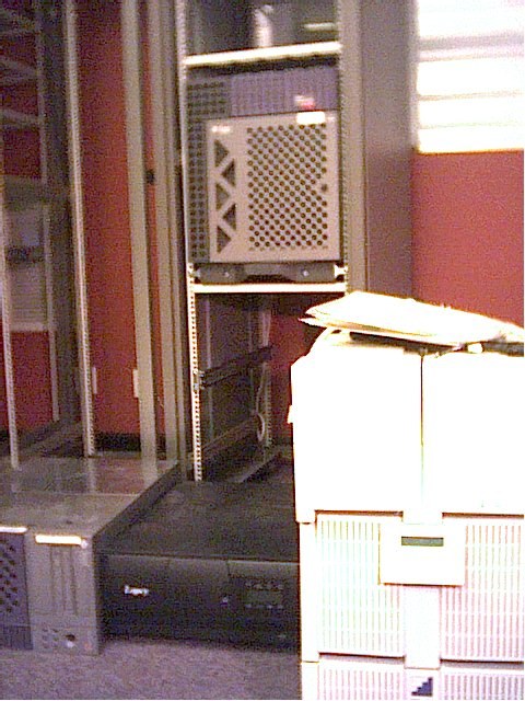 A vertical view of server racks and office equipment.