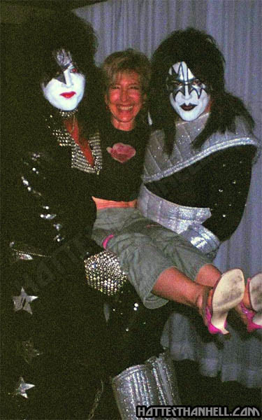 Lin Shaye laughing while Benny Doro and Scott McCluskey lift her between them in KISS makeup