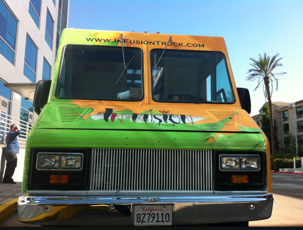 The orange-and-lime InFusion food truck photographed straight on like a portrait.