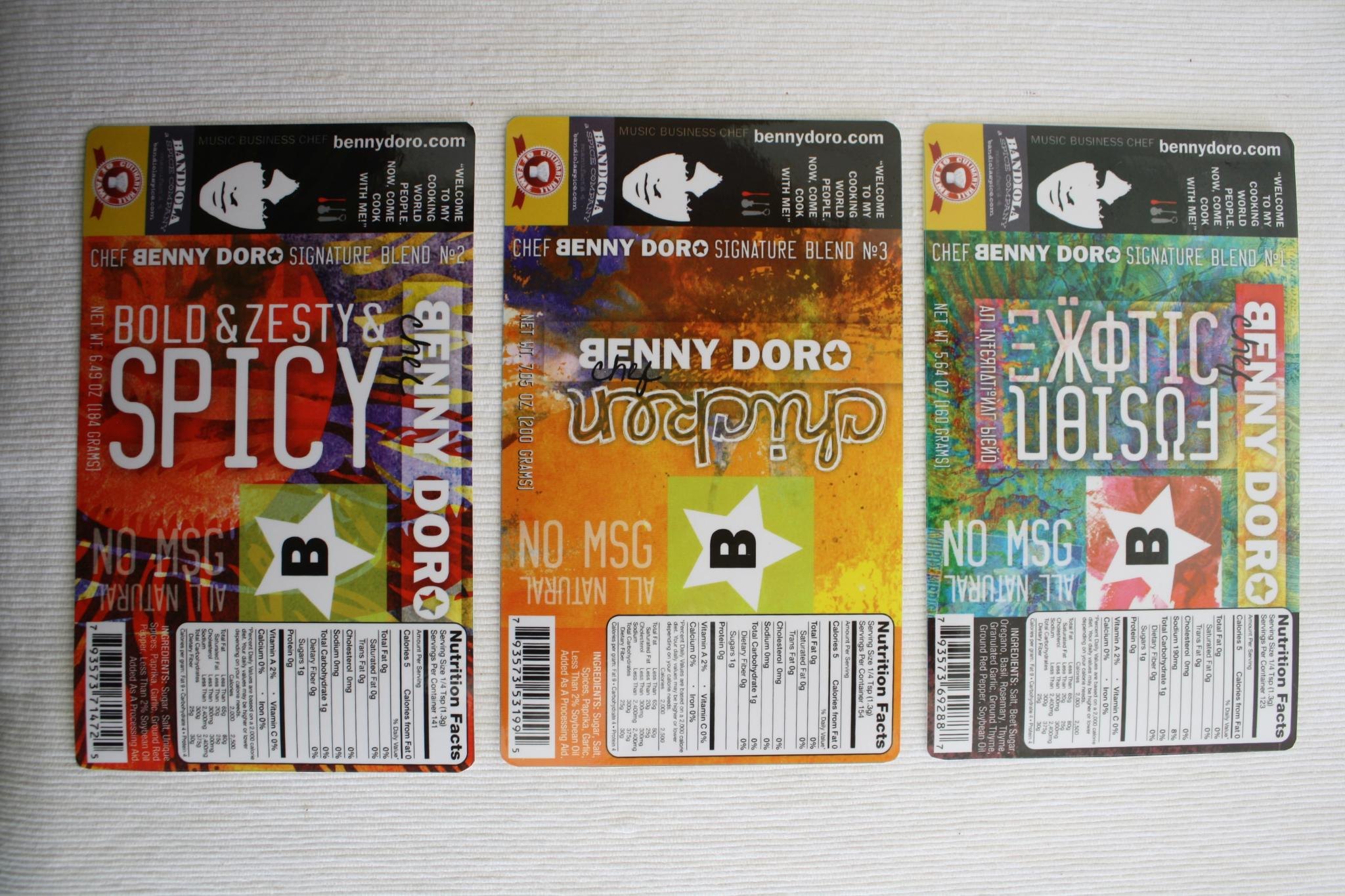 The three colorful Benny Doro spice labels shown at an angle.