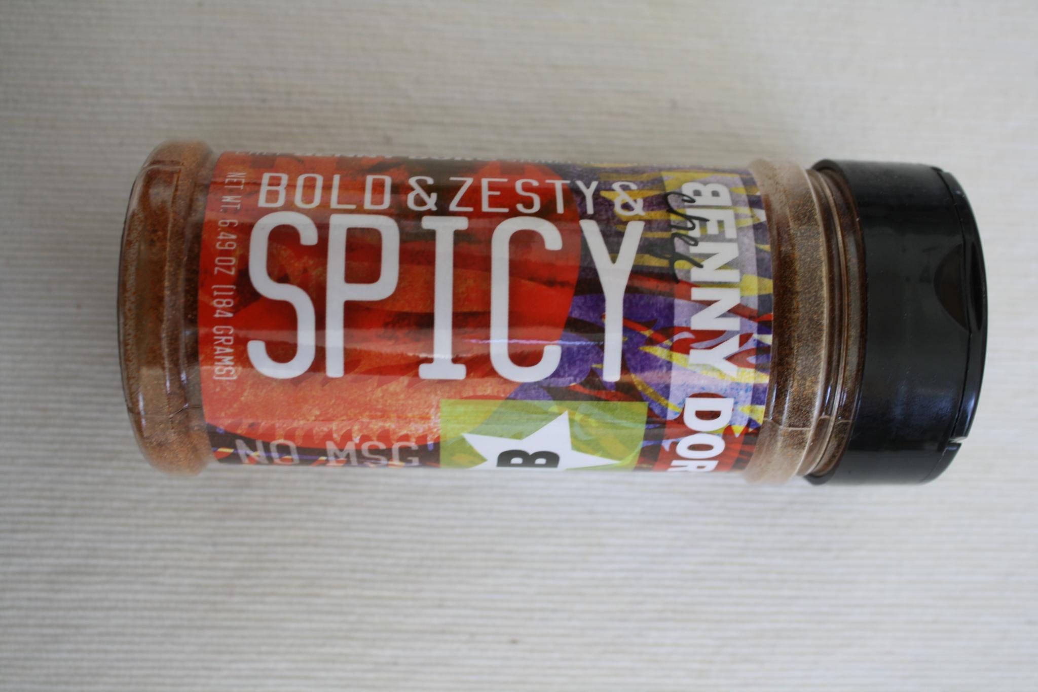 A finished shaker of Benny Doro Bold and Zesty Spicy seasoning.