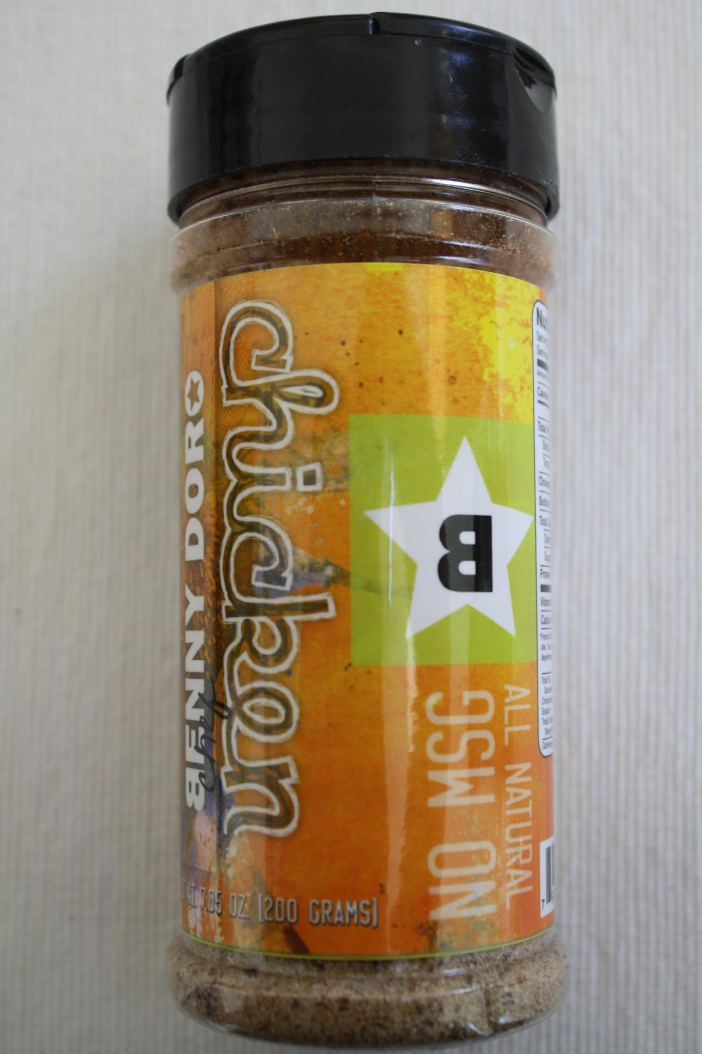 A finished Benny Doro Chicken seasoning shaker with its star mark.