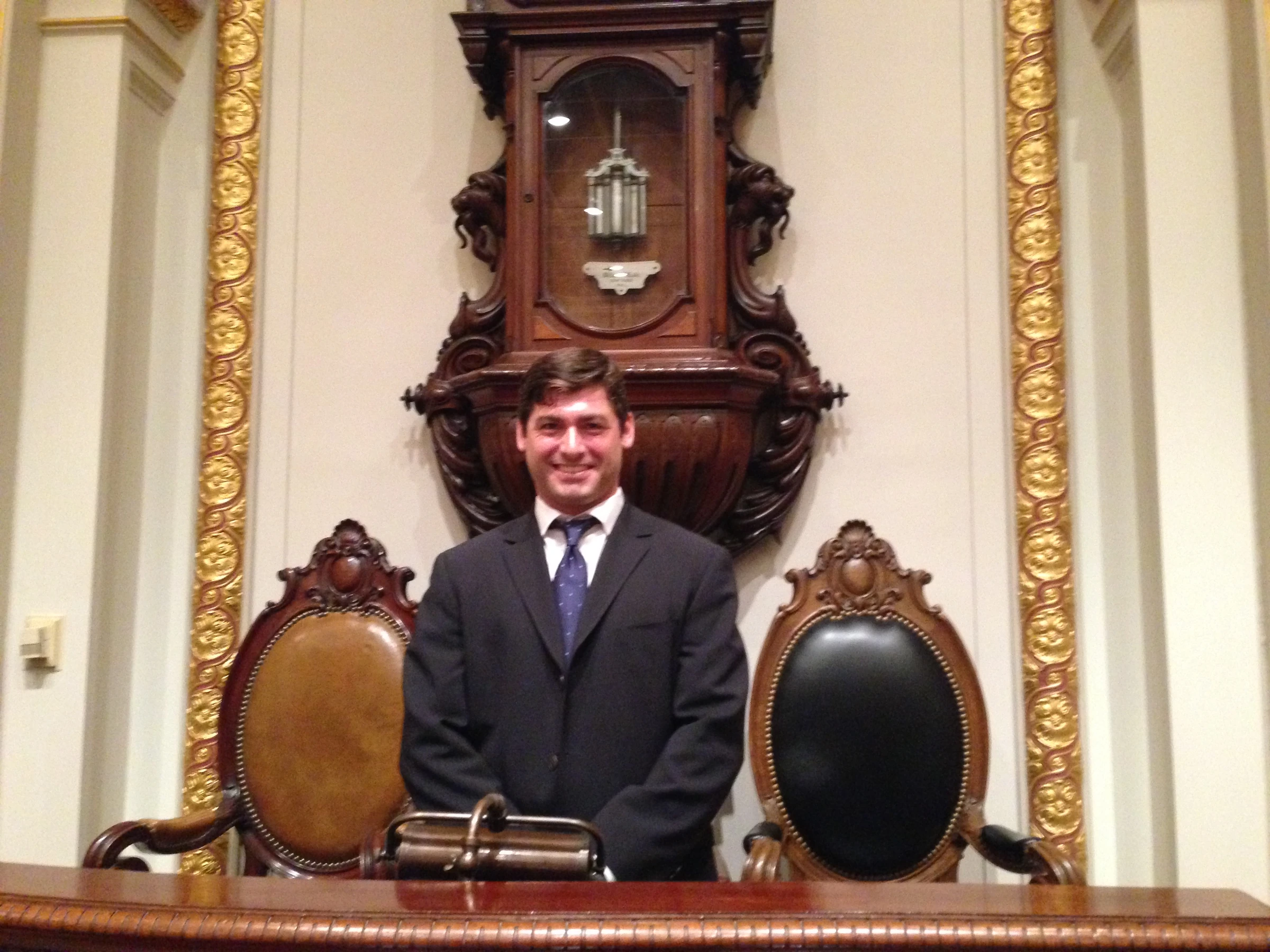 Adam beneath the boardroom clock