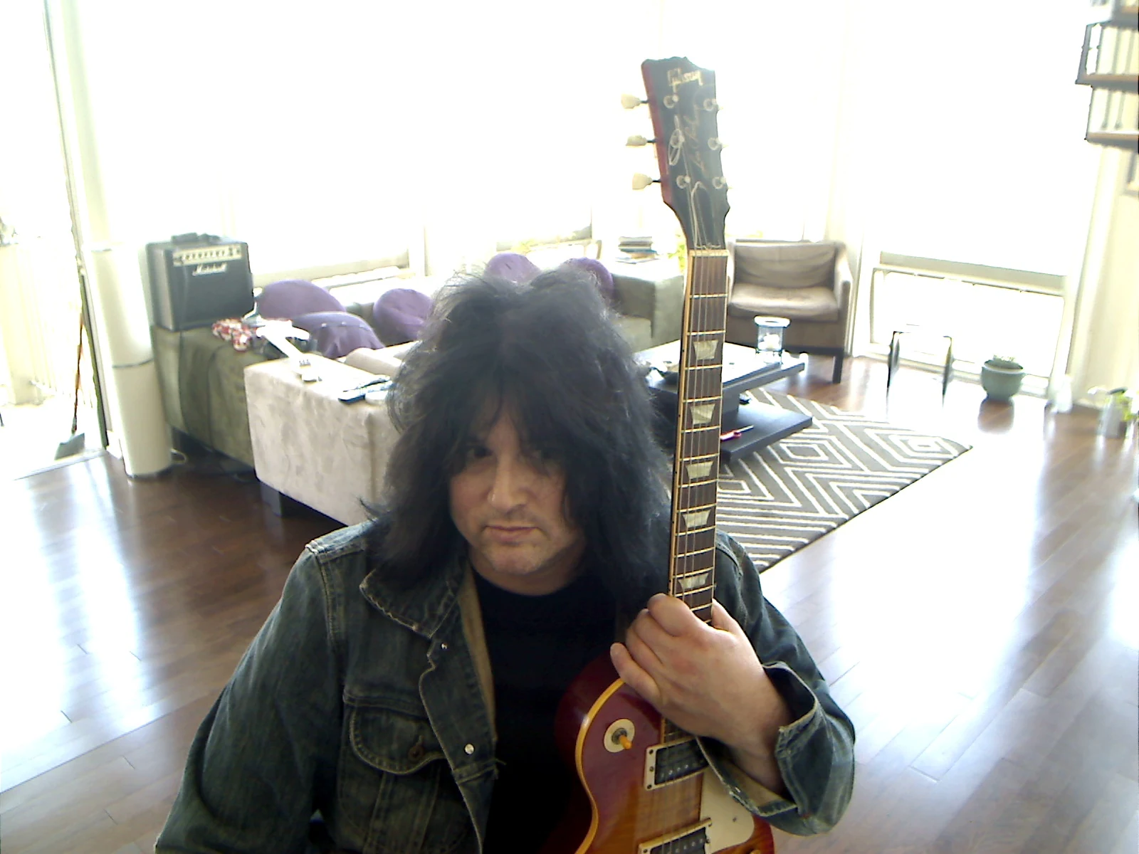 Benny holding the Les Paul vertically.