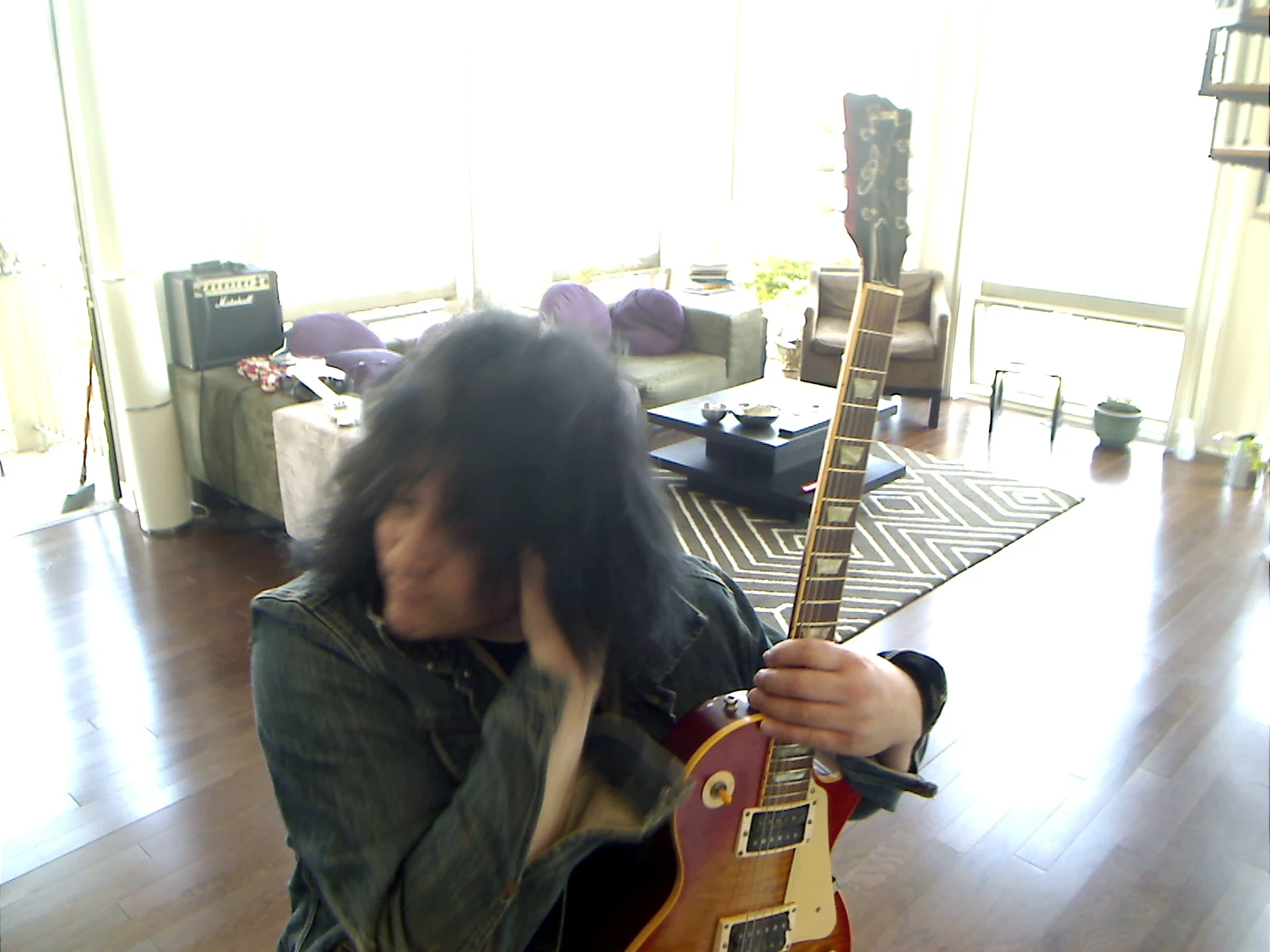 Benny turning with the guitar