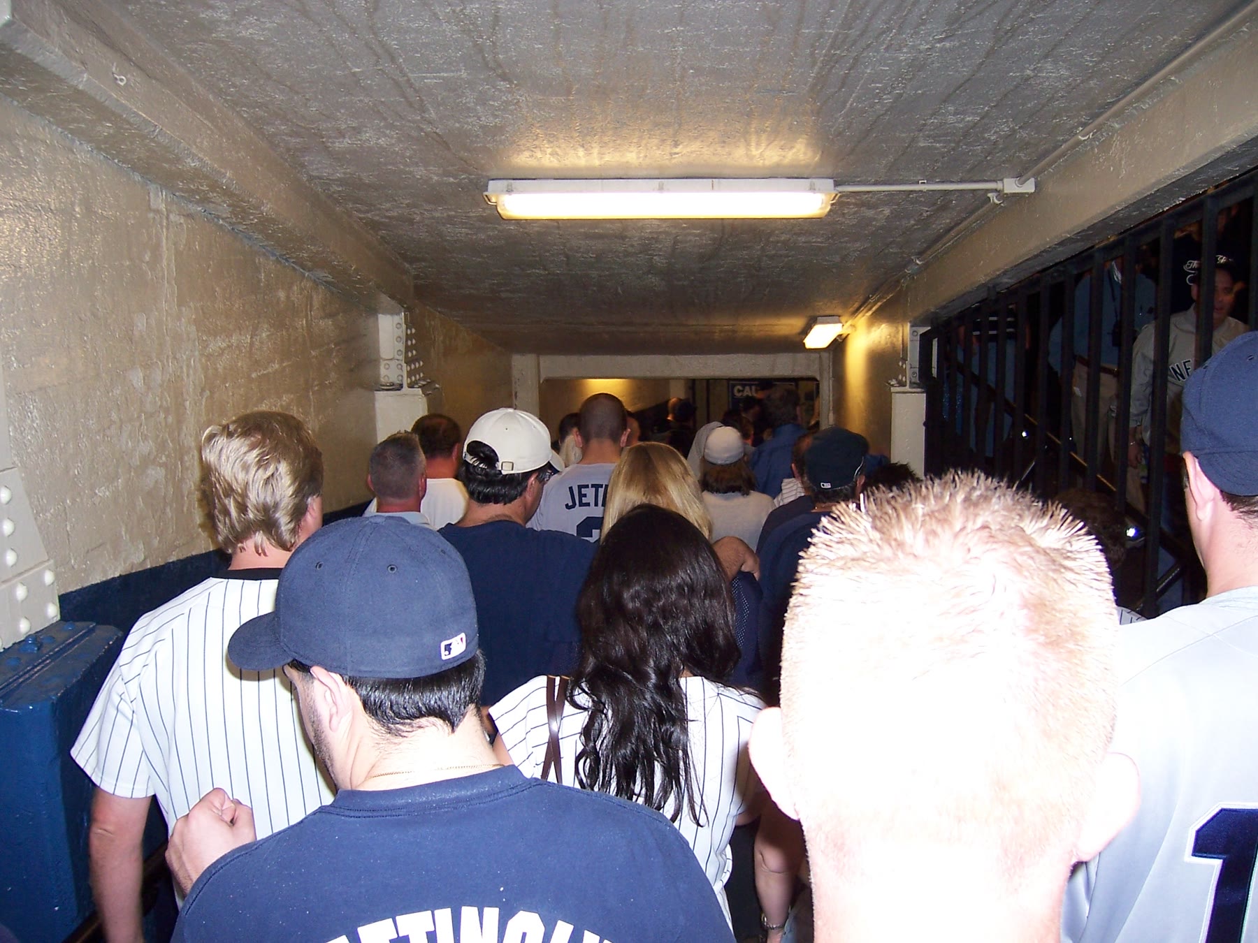 Fans descending through a Yankee Stadium tunnel after the final game.