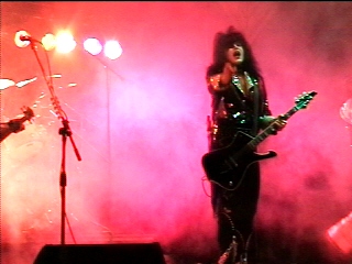 Benny Doro at the microphone as Paul Stanley, photograph 3 of 22