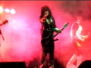 Benny Doro and a bandmate in stage smoke, photograph 4 of 22