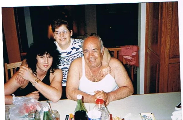Benny Doro with Auntie Nica and Uncle Tony at their table in Hamilton, Ontario.