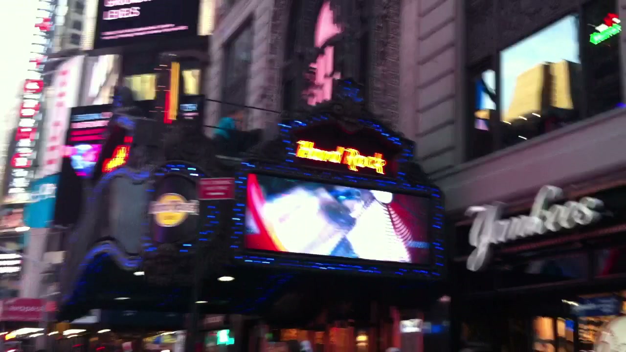 Times Square signs, lights and crowds captured from Benny Doro's moving camera.