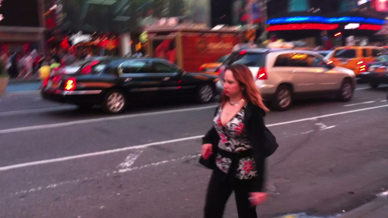 A dense Times Square crowd moving through Midtown.