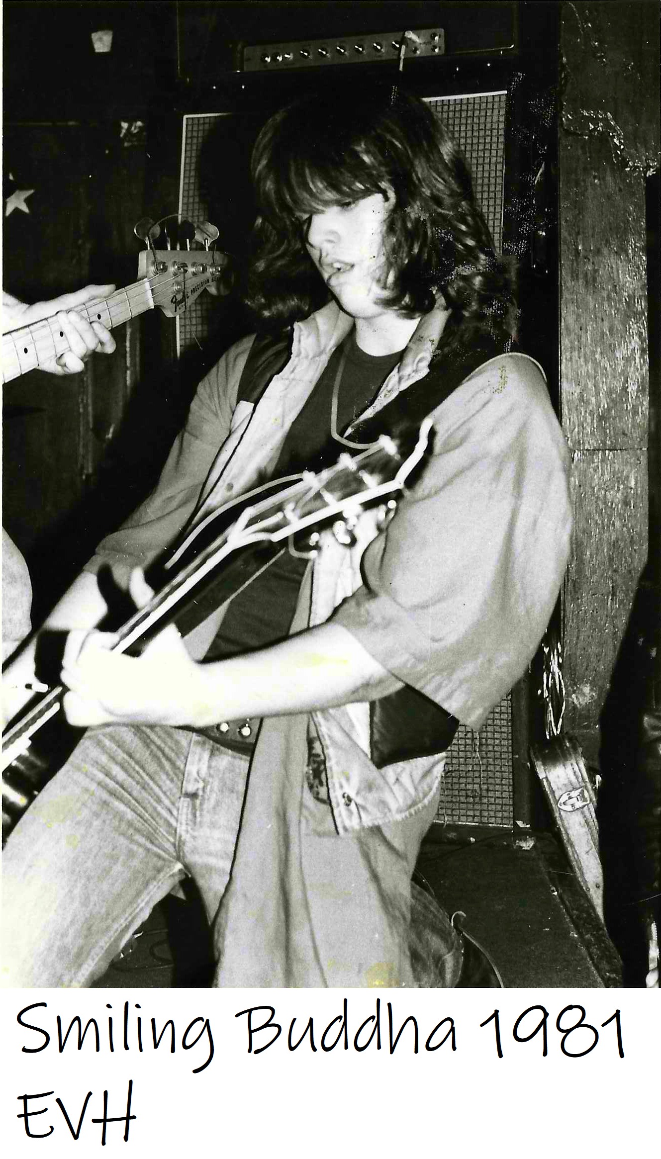 Benny Doro playing guitar onstage at the Smilin’ Buddha.