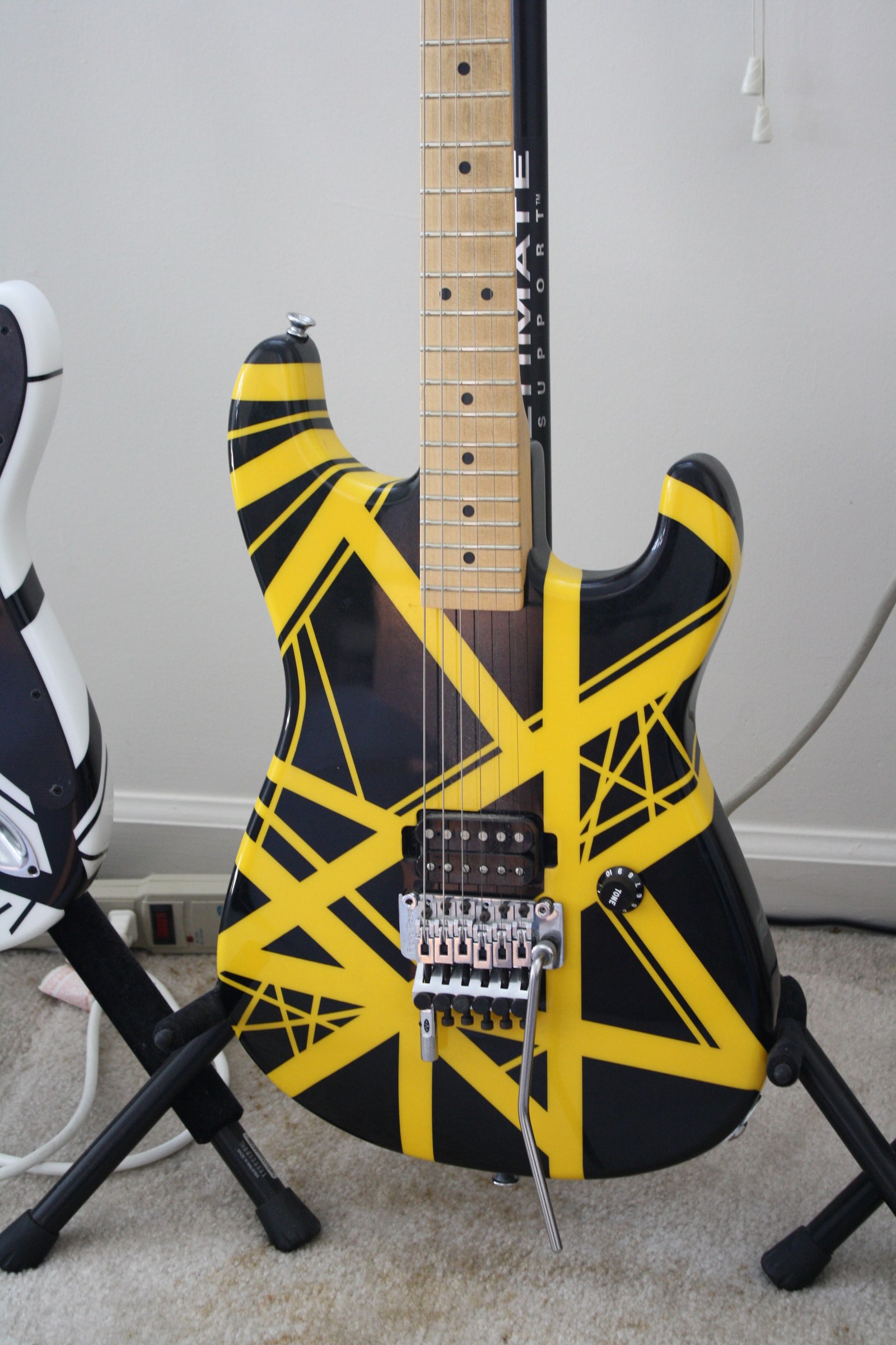 A yellow-and-black striped electric guitar.