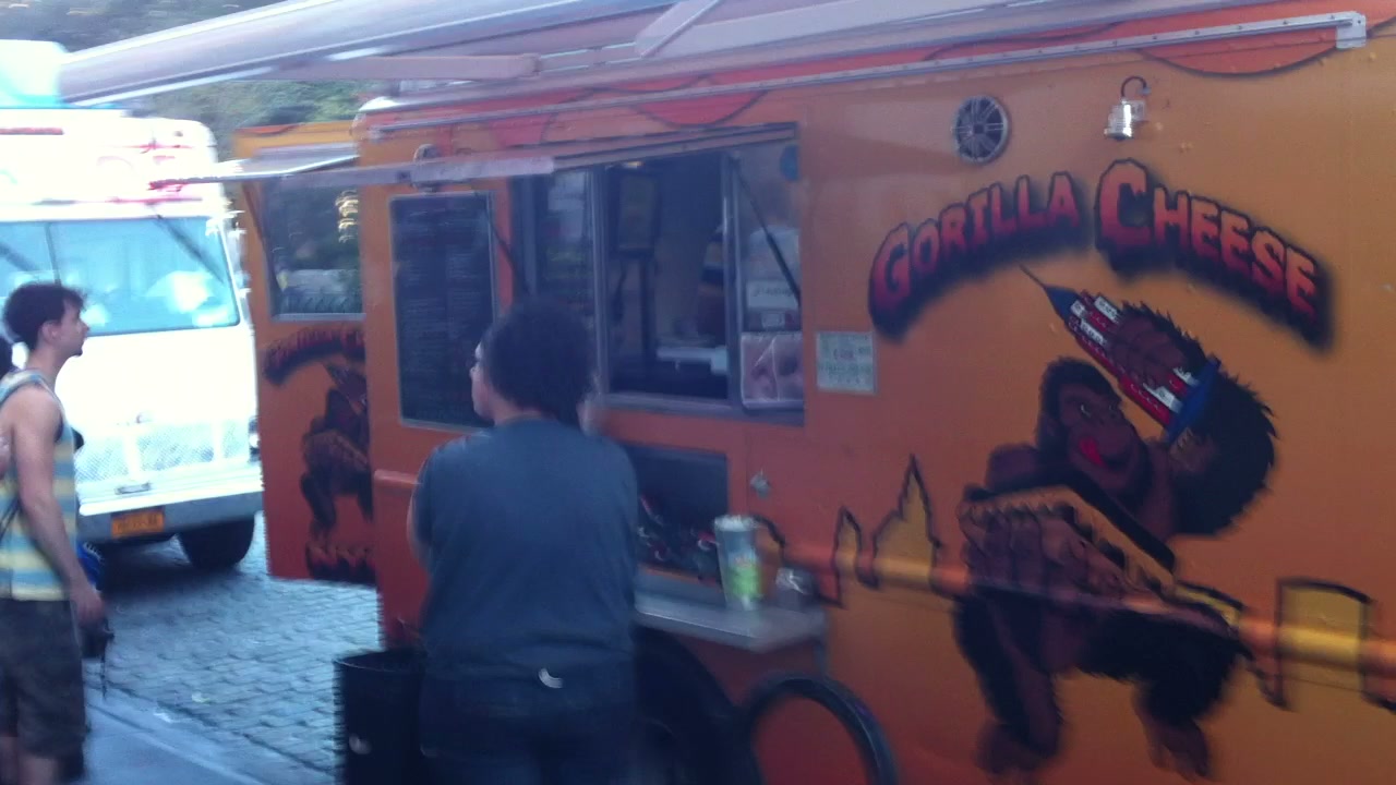 A brightly branded grilled-cheese truck on the Union Square curb.